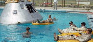 Astronaut relaxing in pool